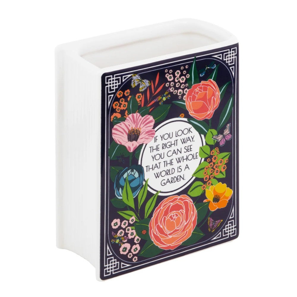 Floral vase with an inspirational quote framed by colorful flowers and butterflies.