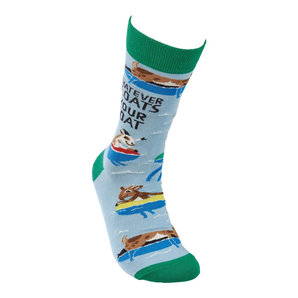 Blue sock with animals on boats, green cuff, and playful text.