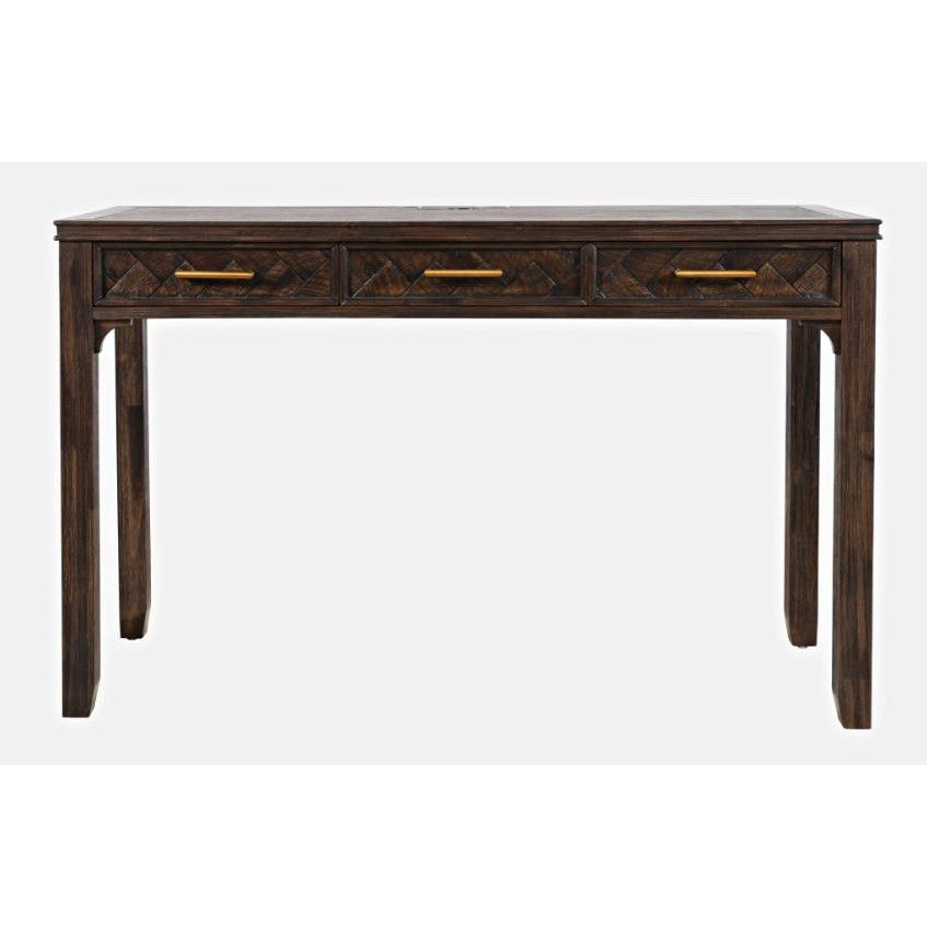 Dark wooden desk with three drawers and gold handles.