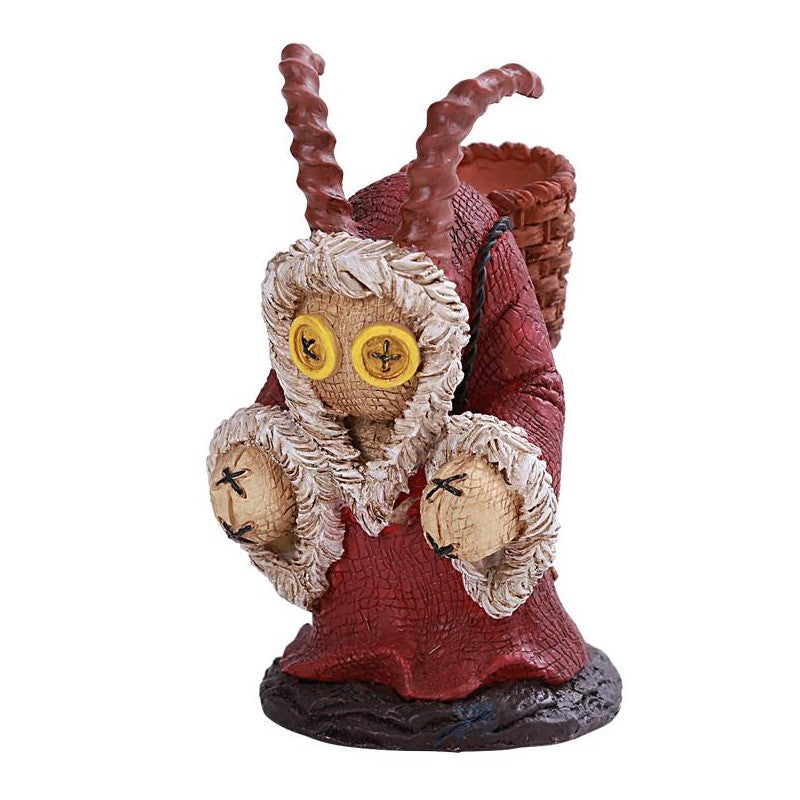 A whimsical horned figure with button eyes and a basket on its back.