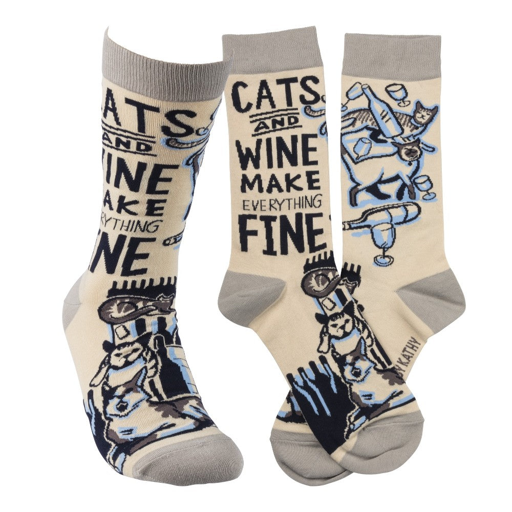 Socks with playful cats and wine design, text: "Cats and wine make everything fine."