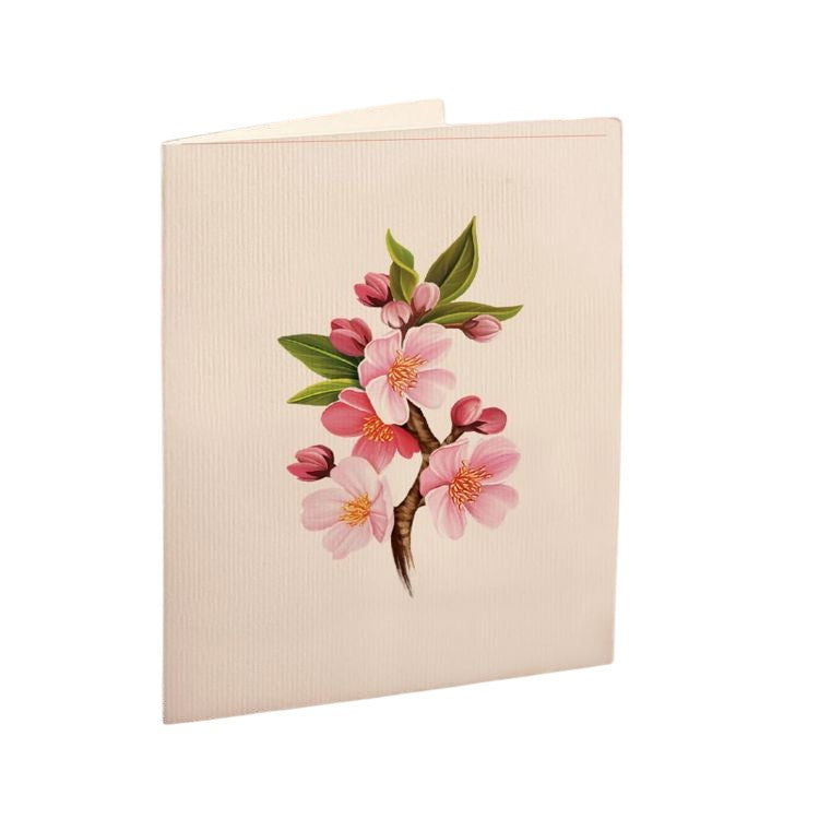 Card with pink cherry blossoms and green leaves on the cover.