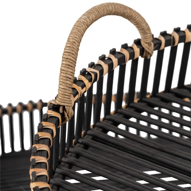 Close-up of a woven black and tan basket with a rope handle.