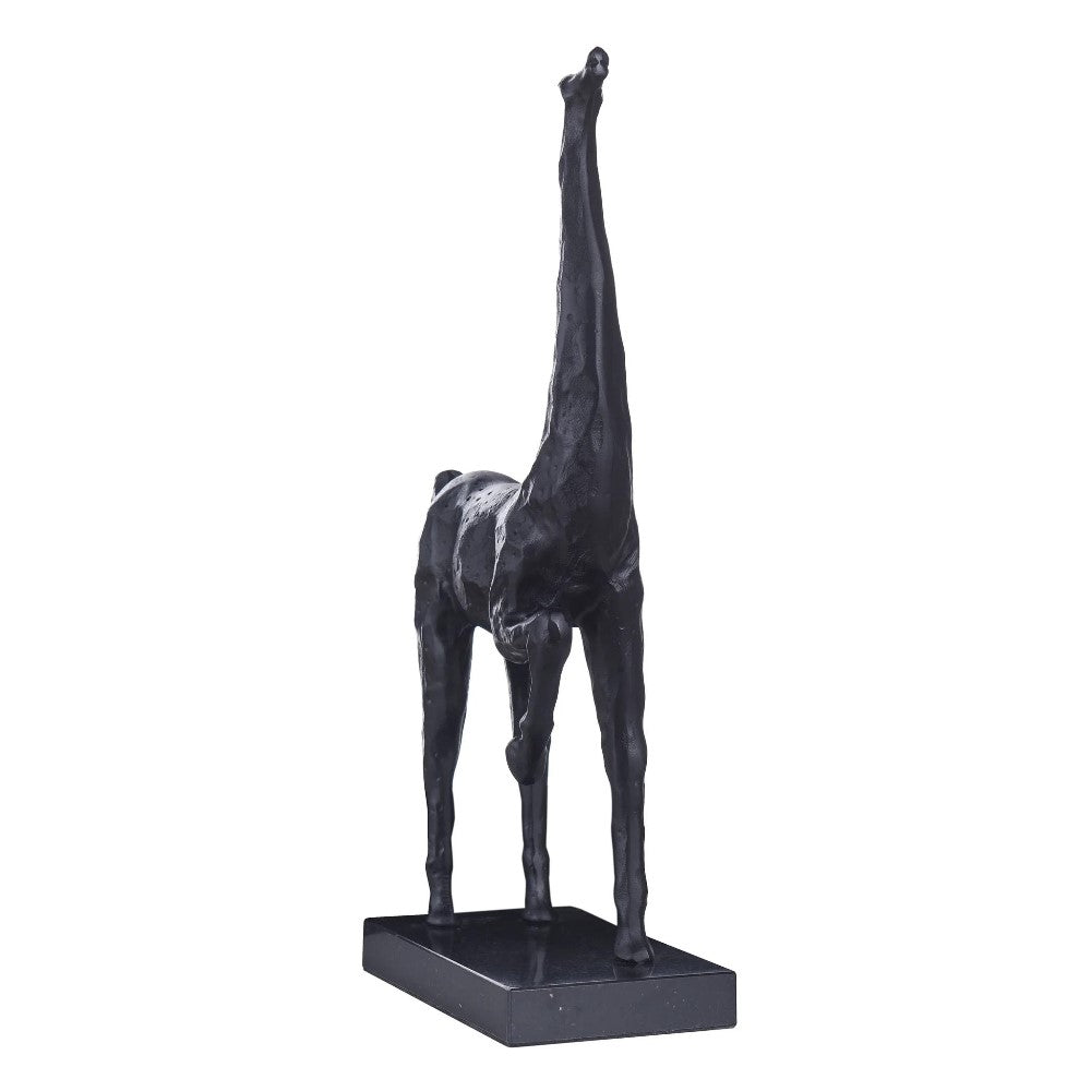 Black giraffe sculpture on a rectangular base.