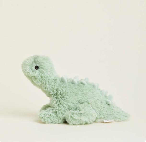 Green plush dinosaur toy on a plain background.