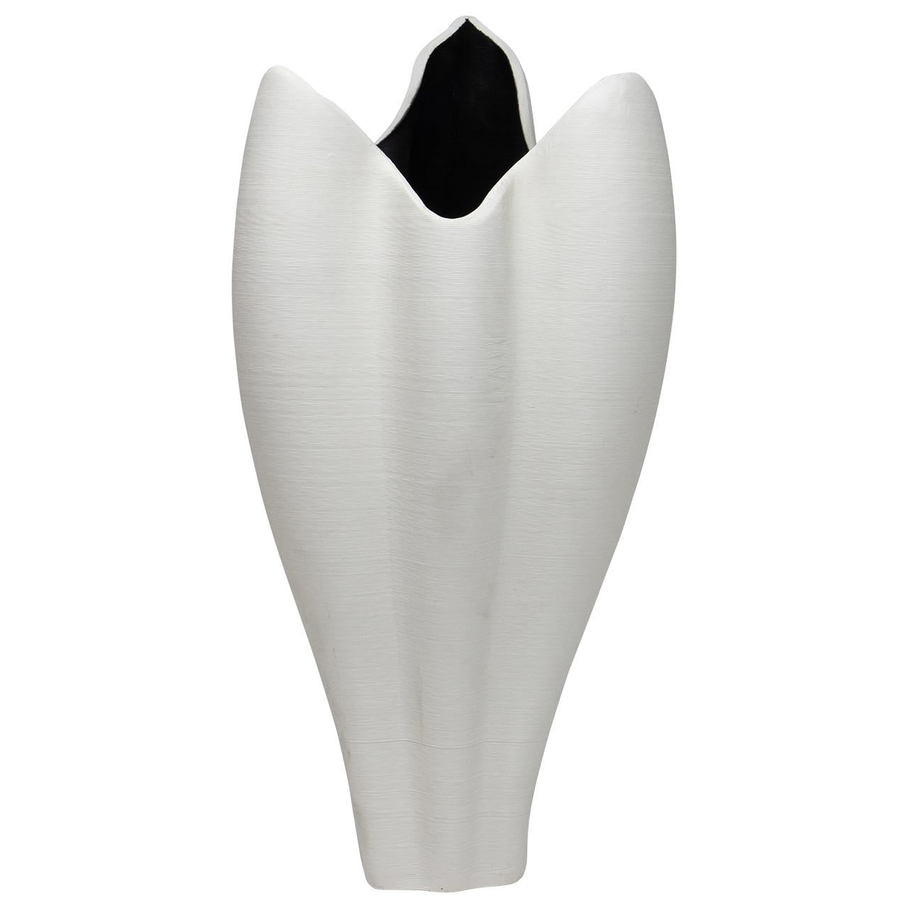 White, abstract ceramic vase with an elegant, flowing design.
