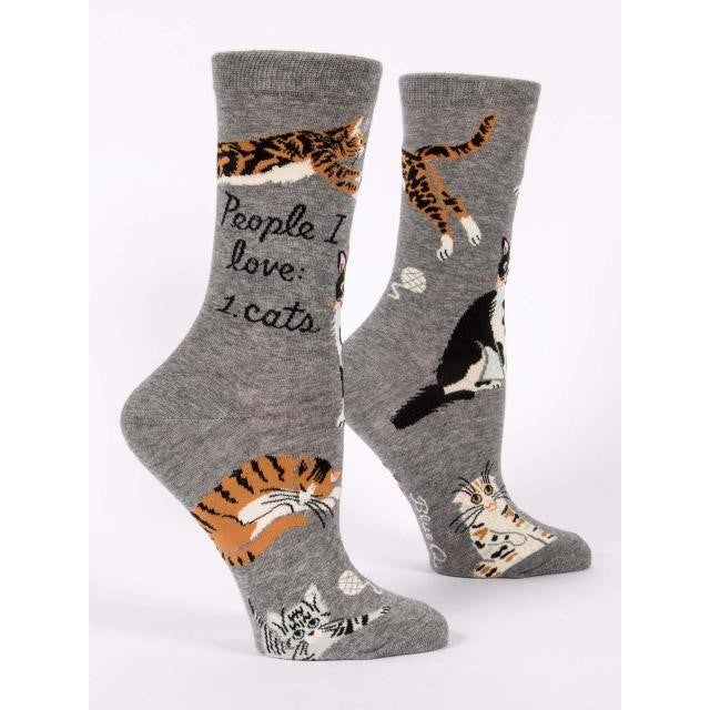Gray socks with playful cat designs and "People I love: 1. Cats" text.