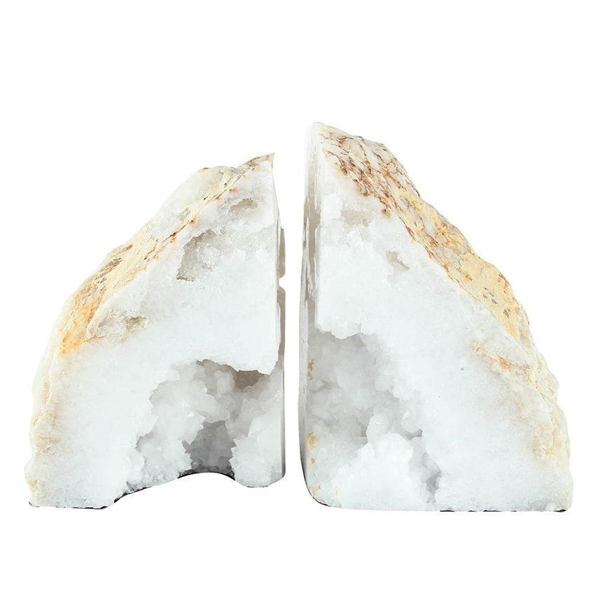 Two halves of a white geode with crystals inside.