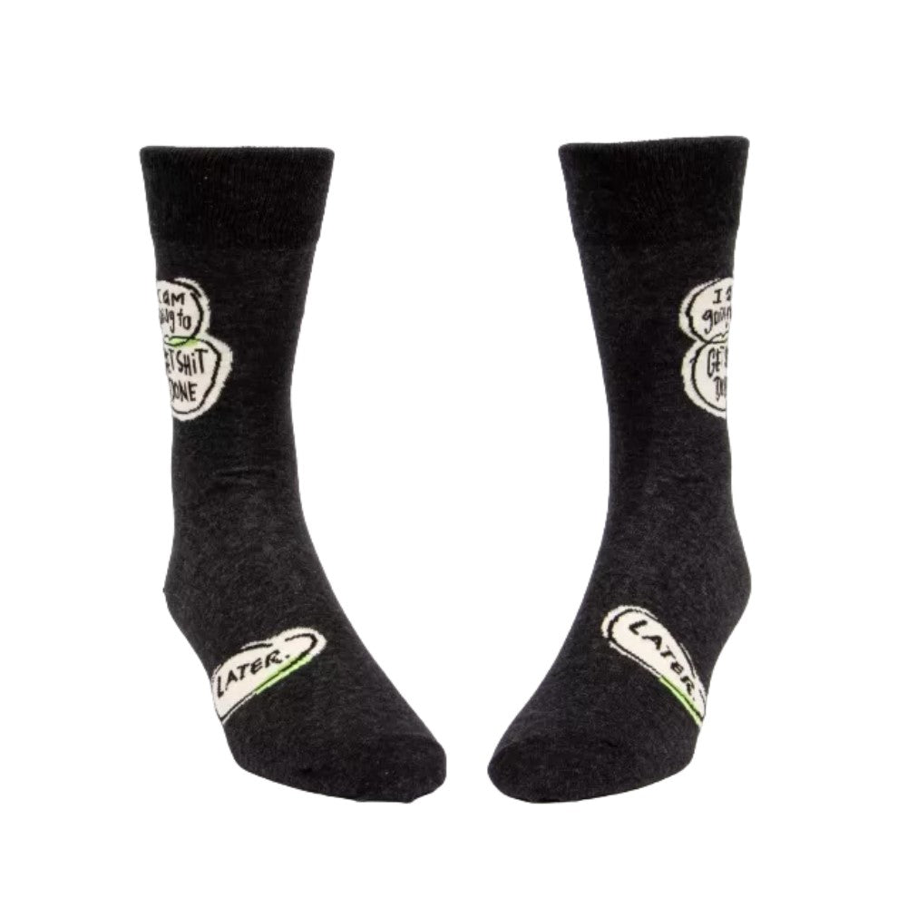 Black socks with humorous motivational text.
