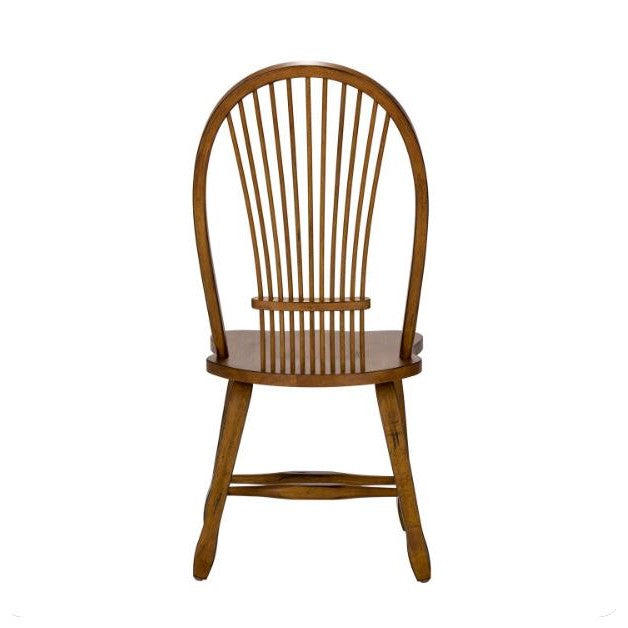 Wooden chair with arched back and spindles, simple design.