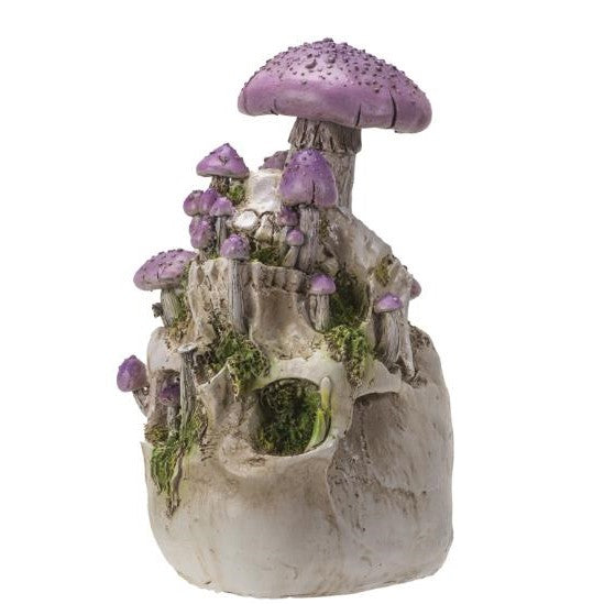 Purple mushrooms on a rocky sculpture with moss accents.