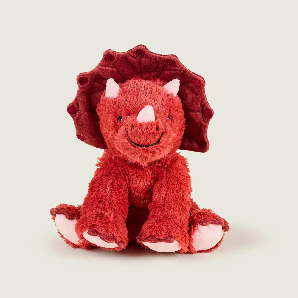 Fluffy red triceratops stuffed animal, sitting happily.