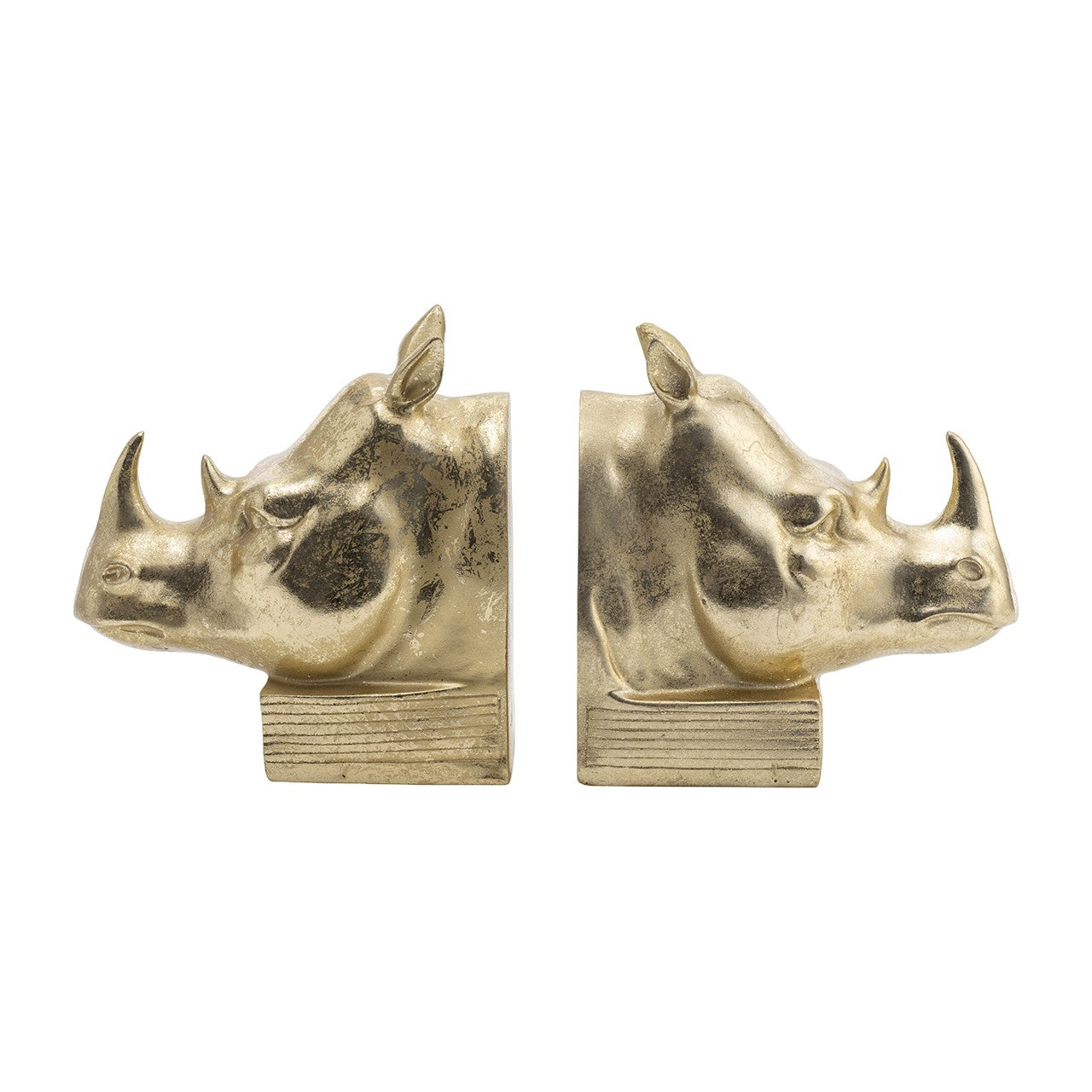 Two gold rhino head bookends facing each other.