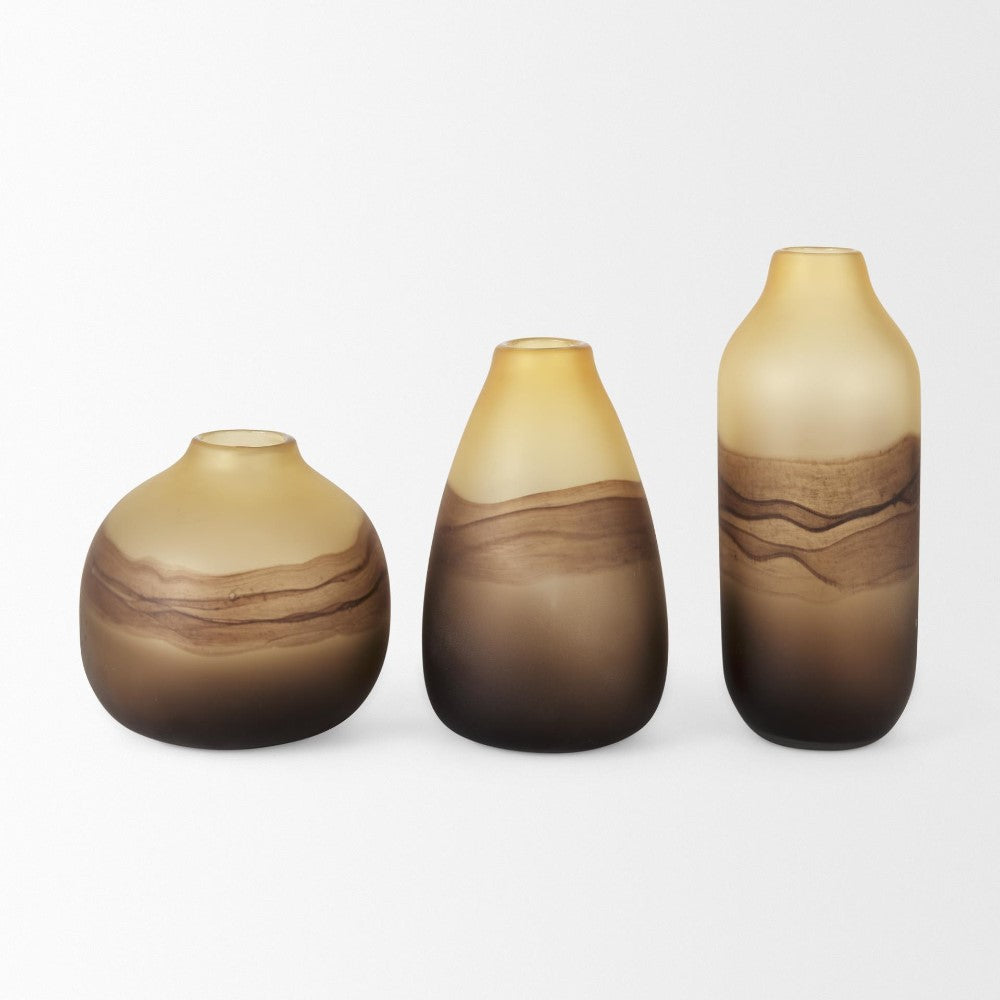 Three gradient vases in earthy tones on a white background.