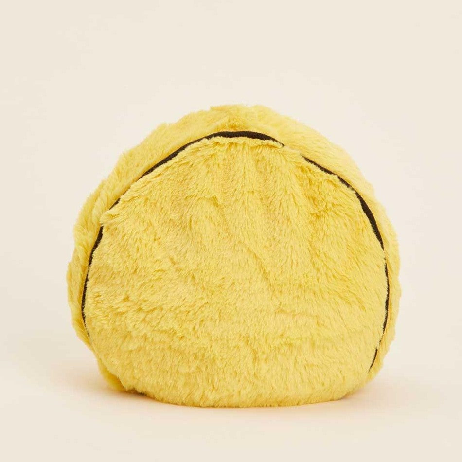 Round fluffy yellow cushion with black line, resembling a stuffed tortilla.