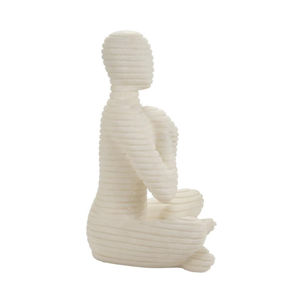 Sculpted figure sitting, made of white stacked layers.