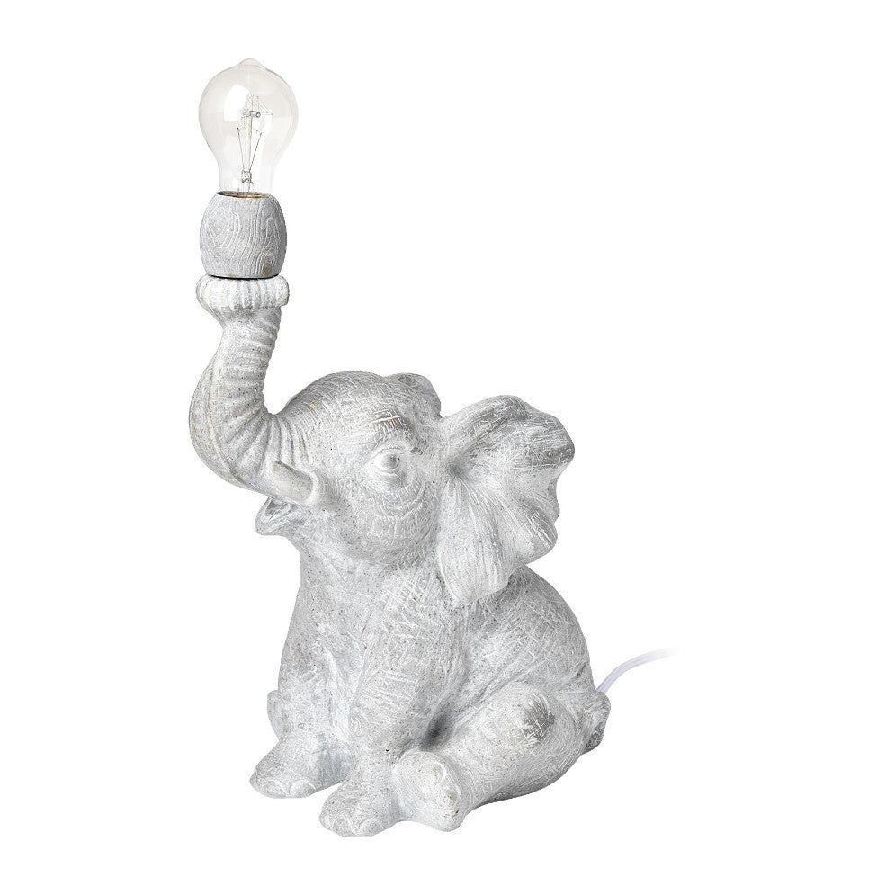 Elephant-shaped lamp with trunk up, holding a light bulb.