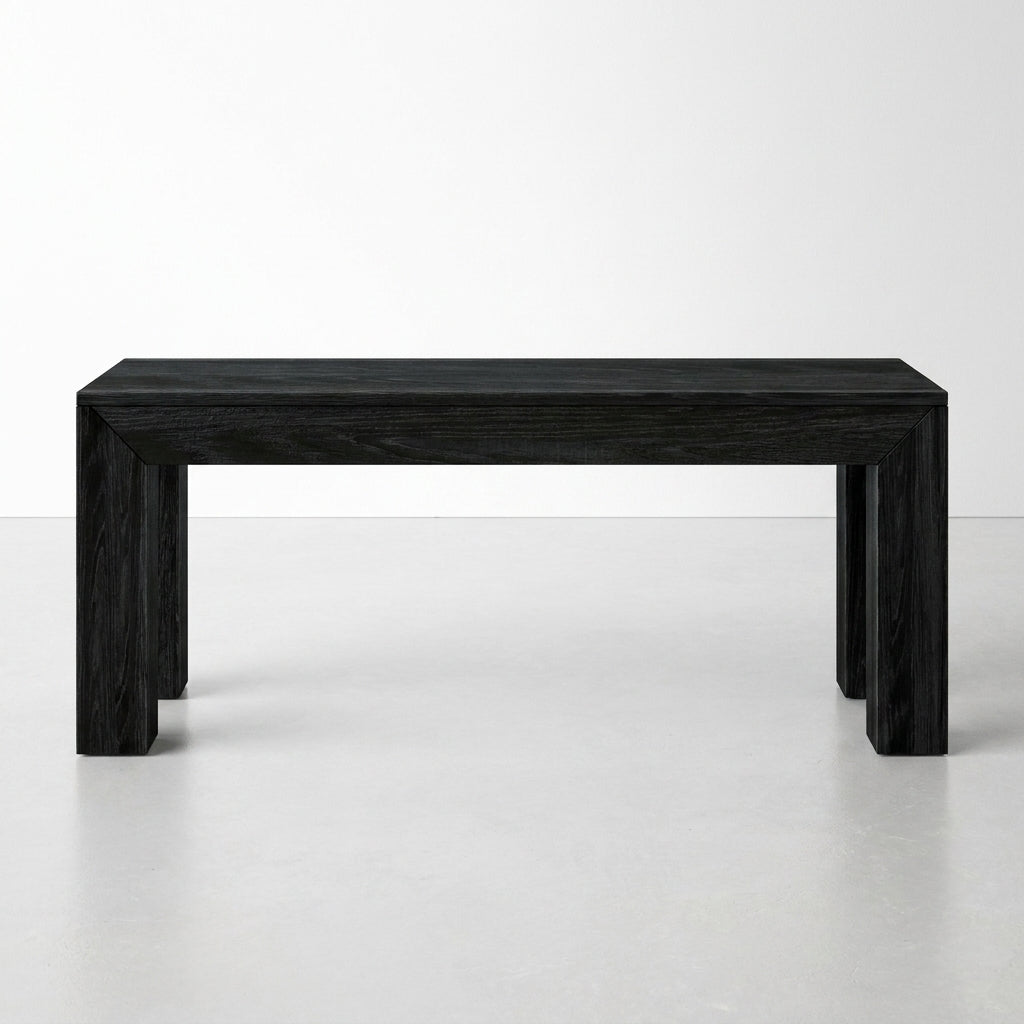 Black wooden table in a minimalistic setting.
