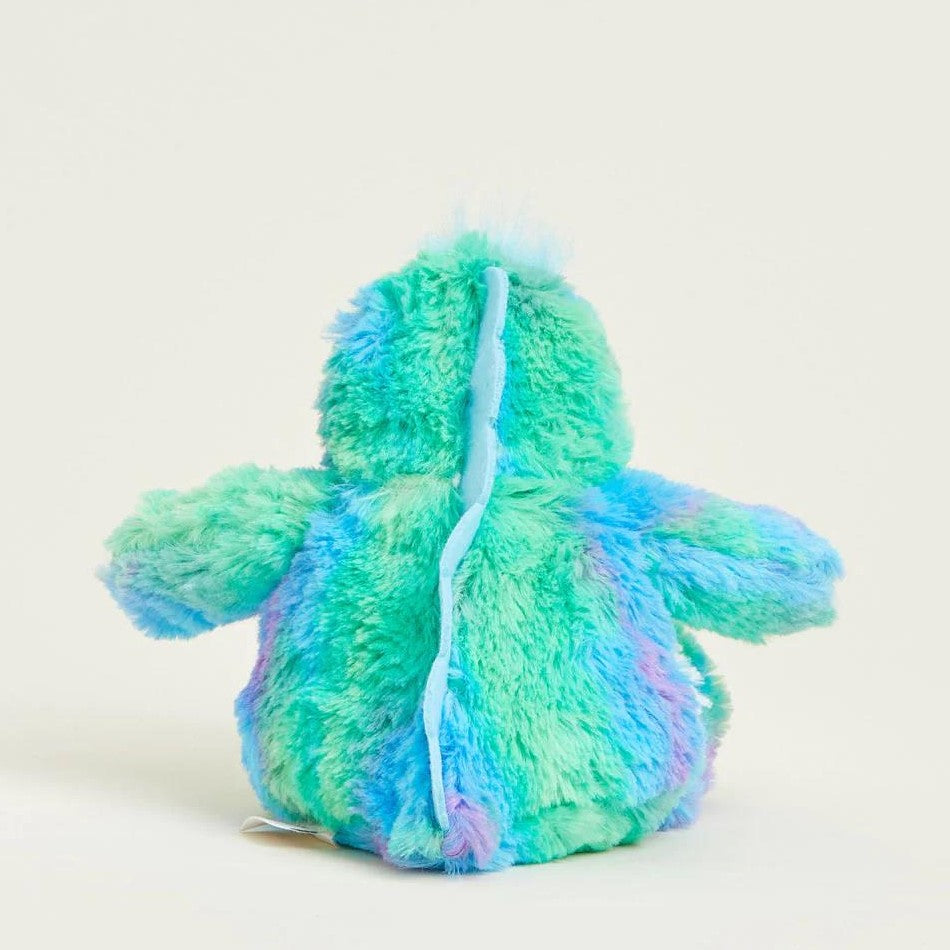 Fluffy, colorful plush dinosaur toy viewed from the back.