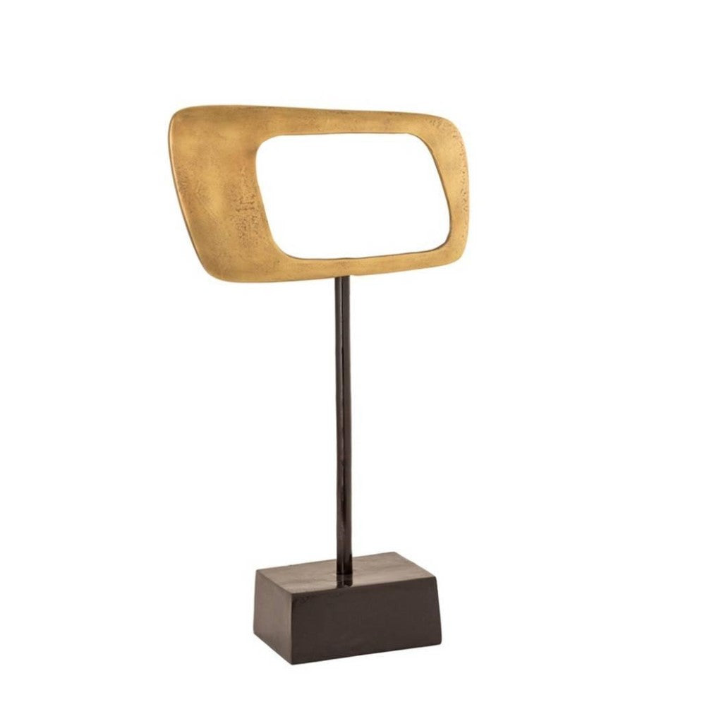 Gold abstract sculpture on a black stand with an open center.