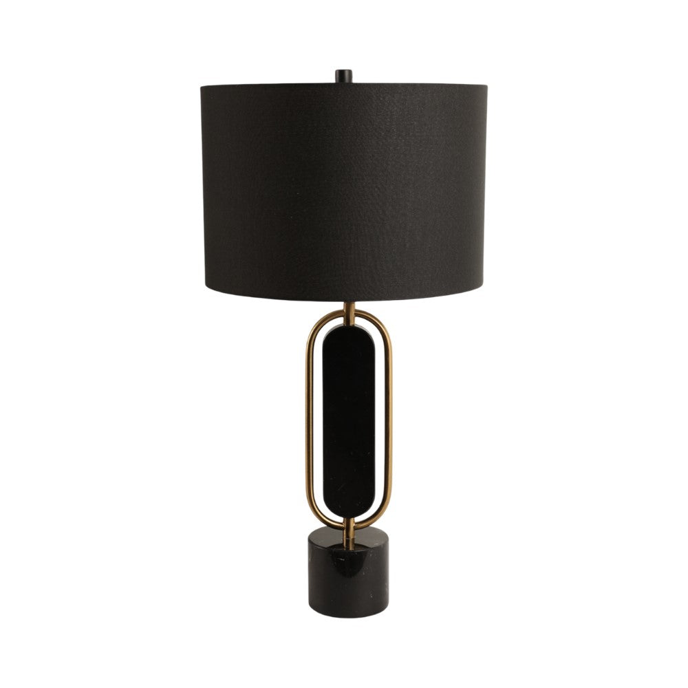 Modern lamp with black shade and brass accents.