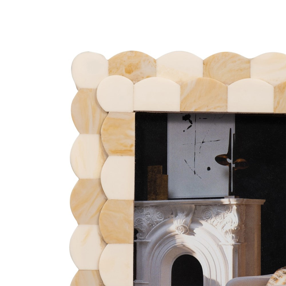 Beige scalloped photo frame corner with artistic interior image.