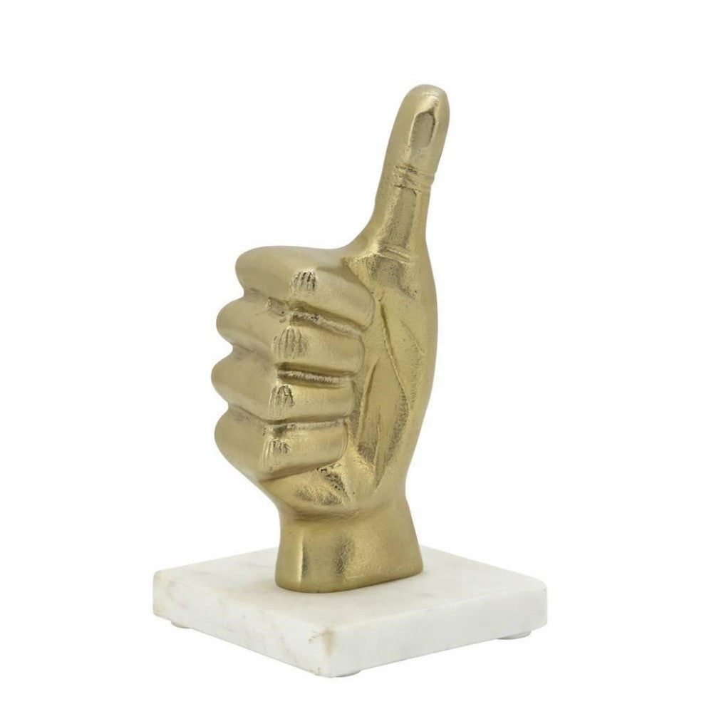 Gold thumbs-up statue on a white base.