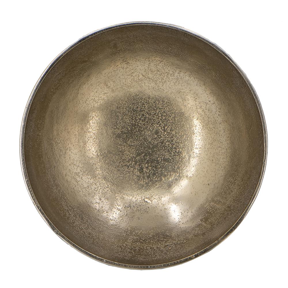A textured, round metal singing bowl, viewed from above.