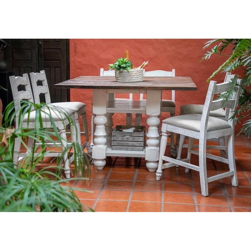 Rustic patio table set with plants, terracotta tiles, and vibrant orange wall.