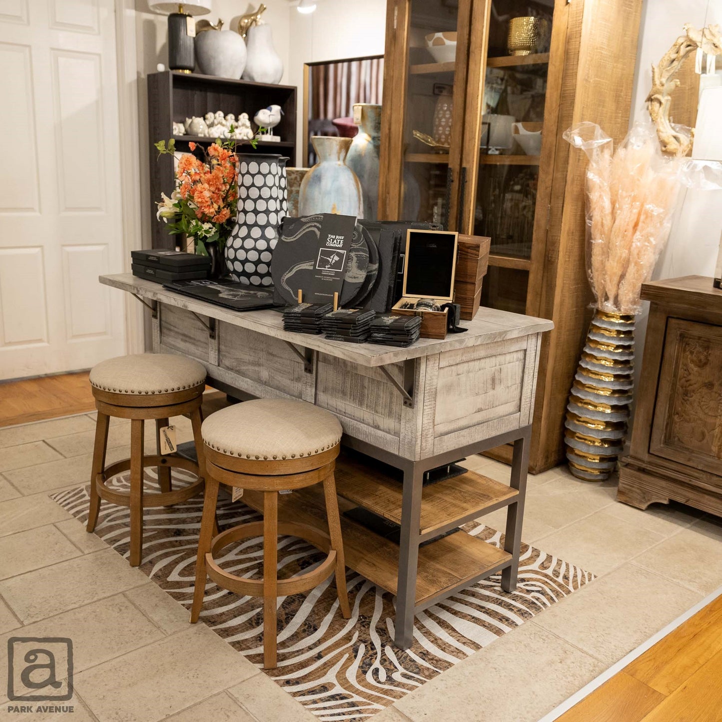 Stylish home decor corner with stools, vases, and wooden accents.