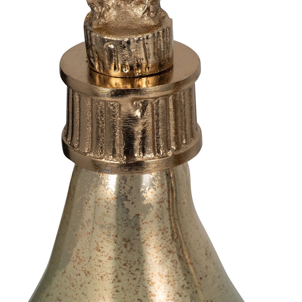 Gold ornamental bottle top with textured details.