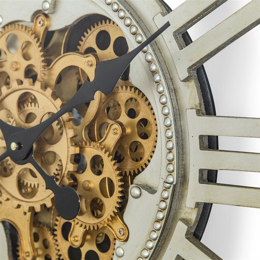 Close-up of clock gears and Roman numeral time markers.