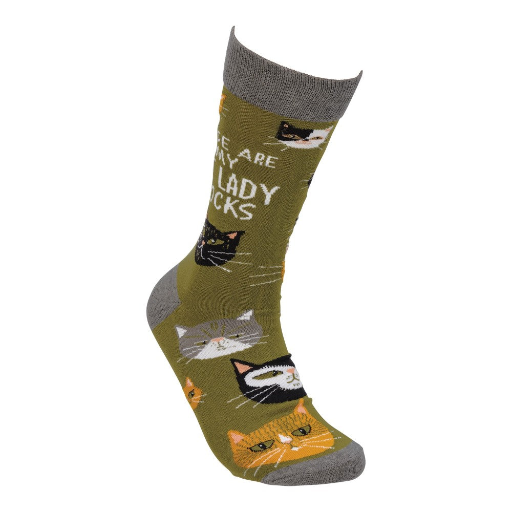 Green sock with cute cat faces and text design.
