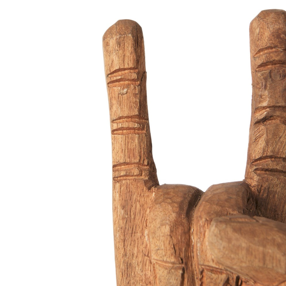 Wooden hand sculpture in a "rock on" gesture.