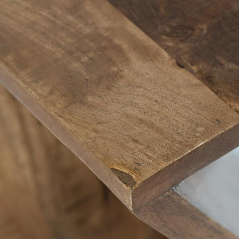 Close-up of a textured wooden surface corner.