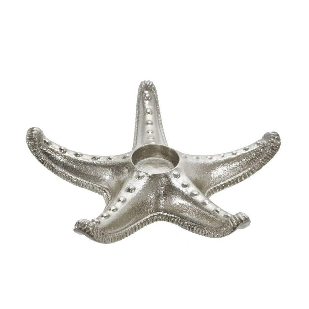Silver starfish-shaped candlestick holder.