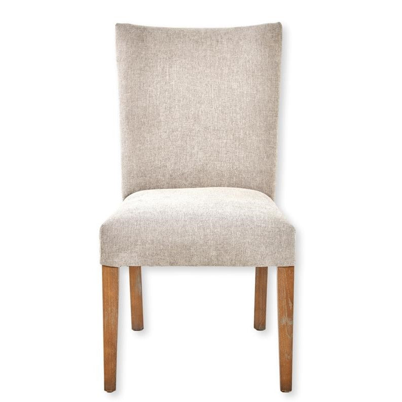 Beige upholstered chair with wooden legs.