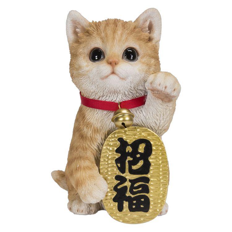 Cute cat figure with red collar and a gold charm.