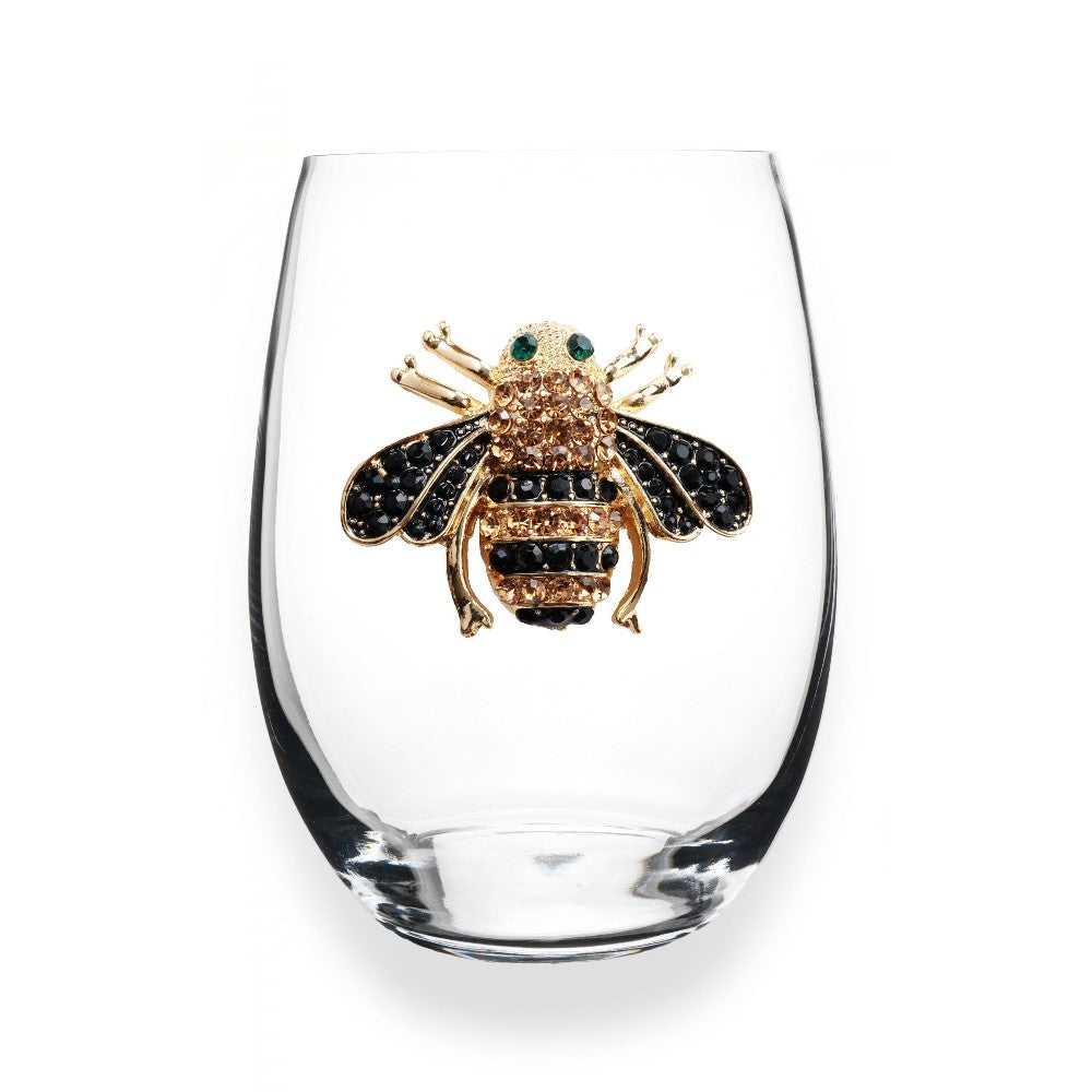 Clear glass with jeweled bee decoration.