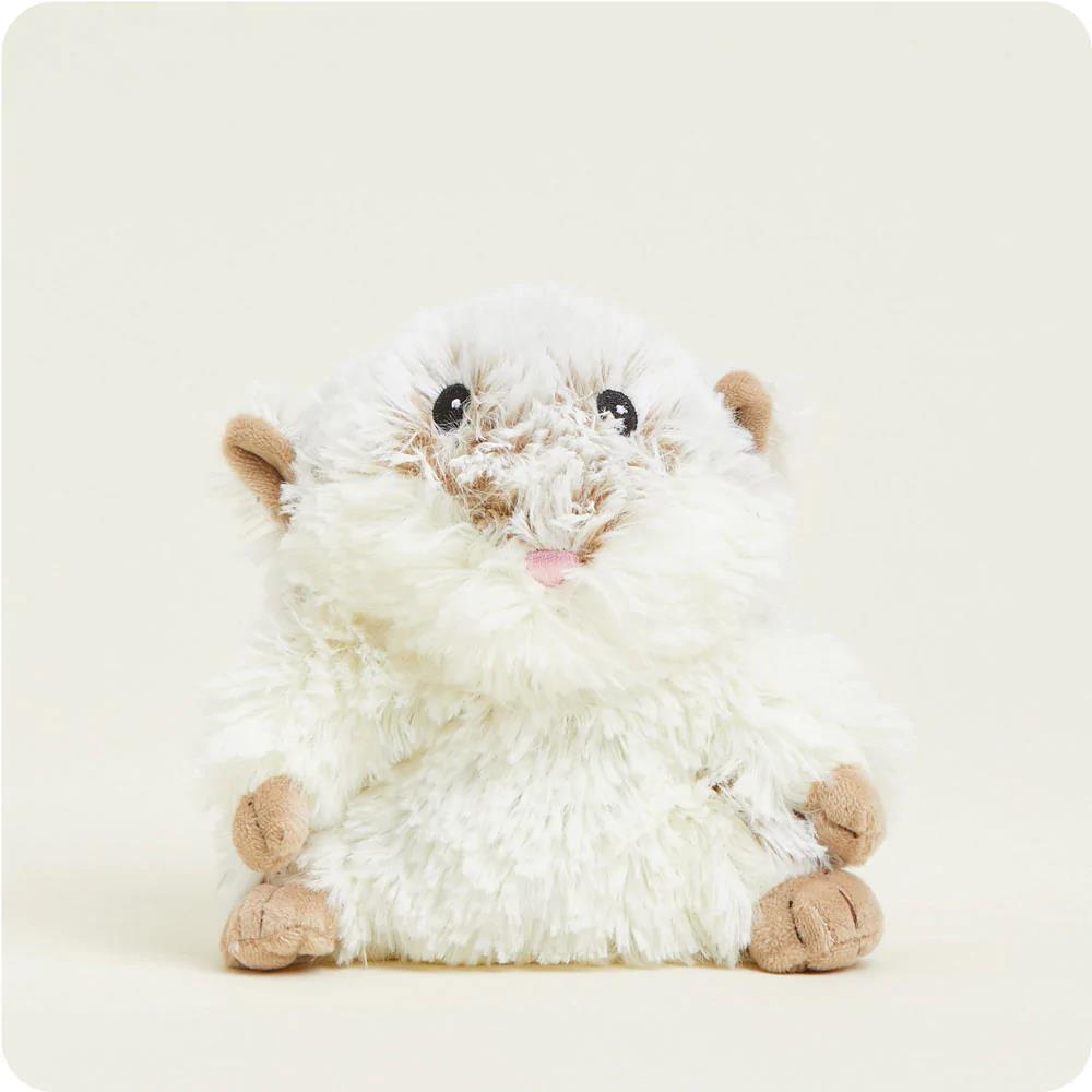 Fluffy plush toy hamster with cute features.