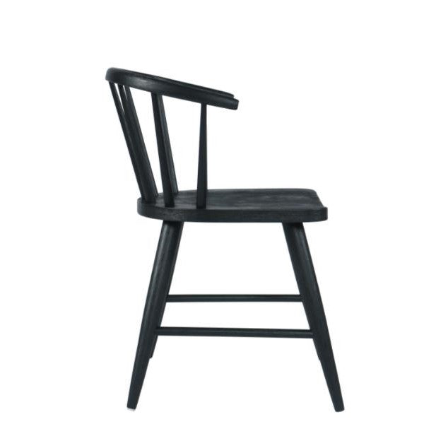 Black wooden chair with spindle back, side view.