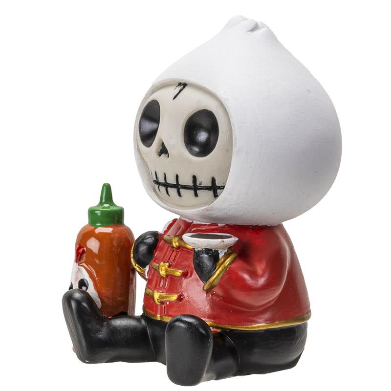 Cute skeleton figurine holding hot sauce, wearing red outfit with white hat.