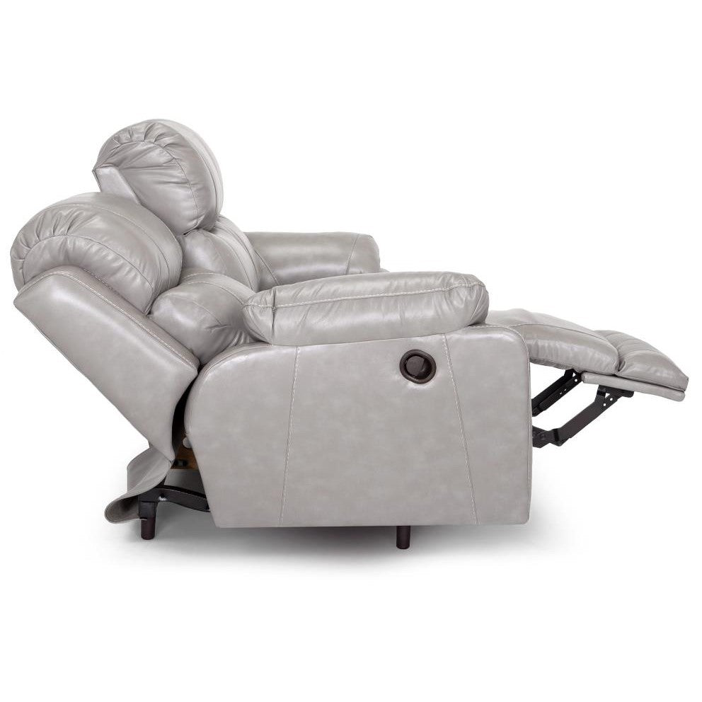 Recliner chair with raised footrest, side view.