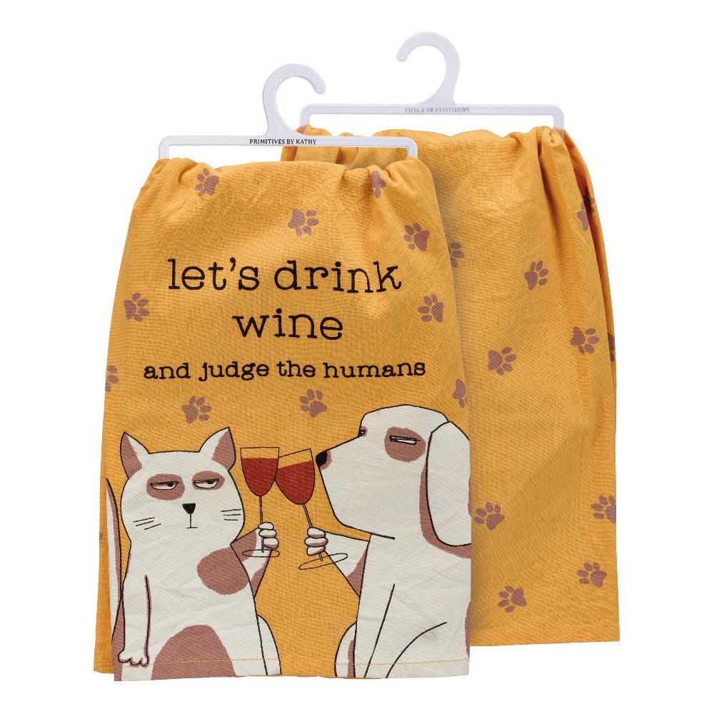 Orange towel with a cat, dog, wine glasses, and the text "let's drink wine and judge."