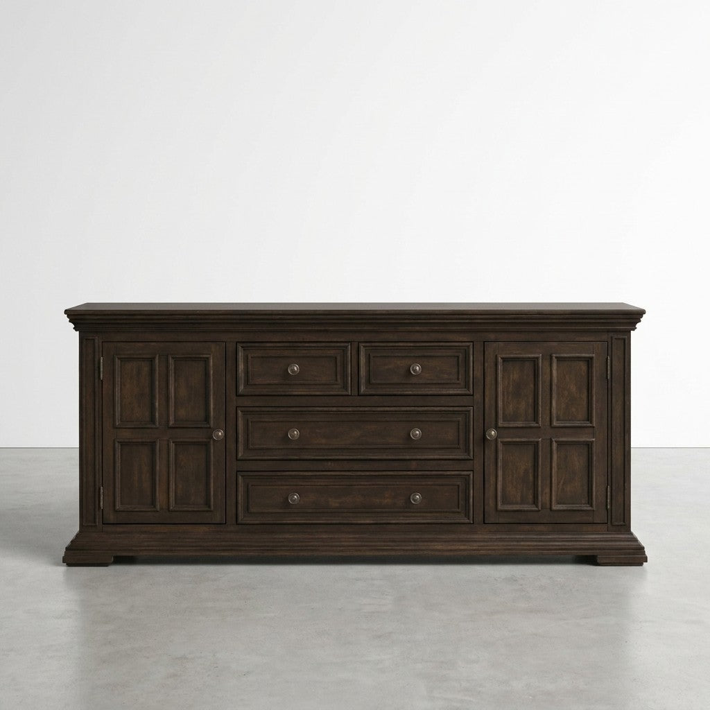 Dark wooden sideboard with drawers and cabinet doors on a gray floor.