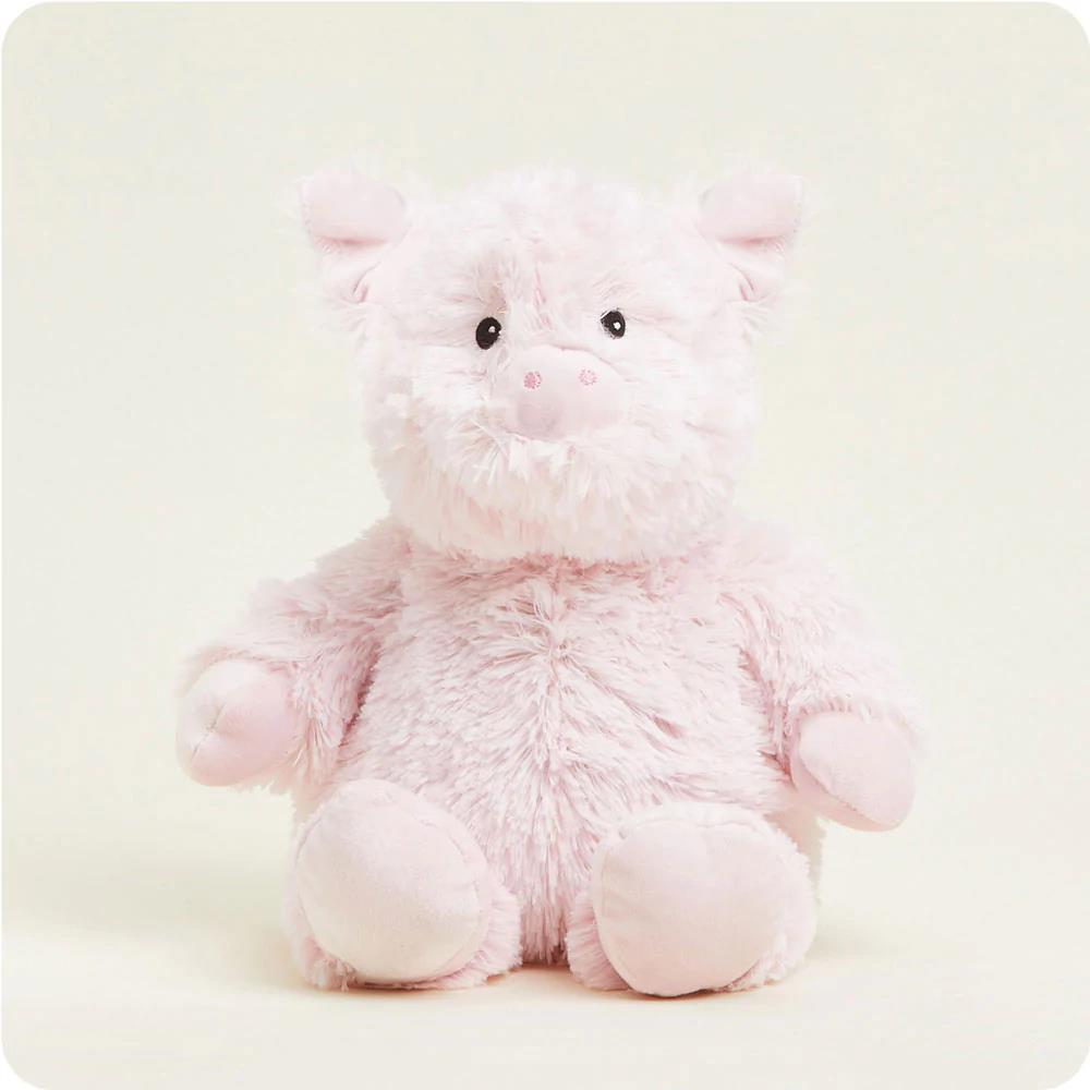 Fluffy pink pig plush toy with a cute expression.