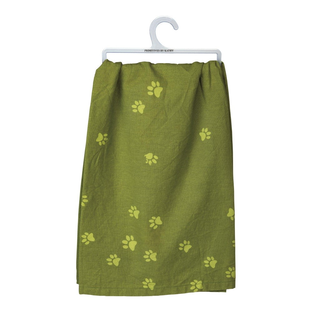 Green towel with yellow paw prints, hanging on a white hanger.