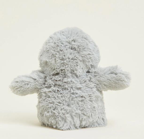 Fluffy gray plush toy with short arms.