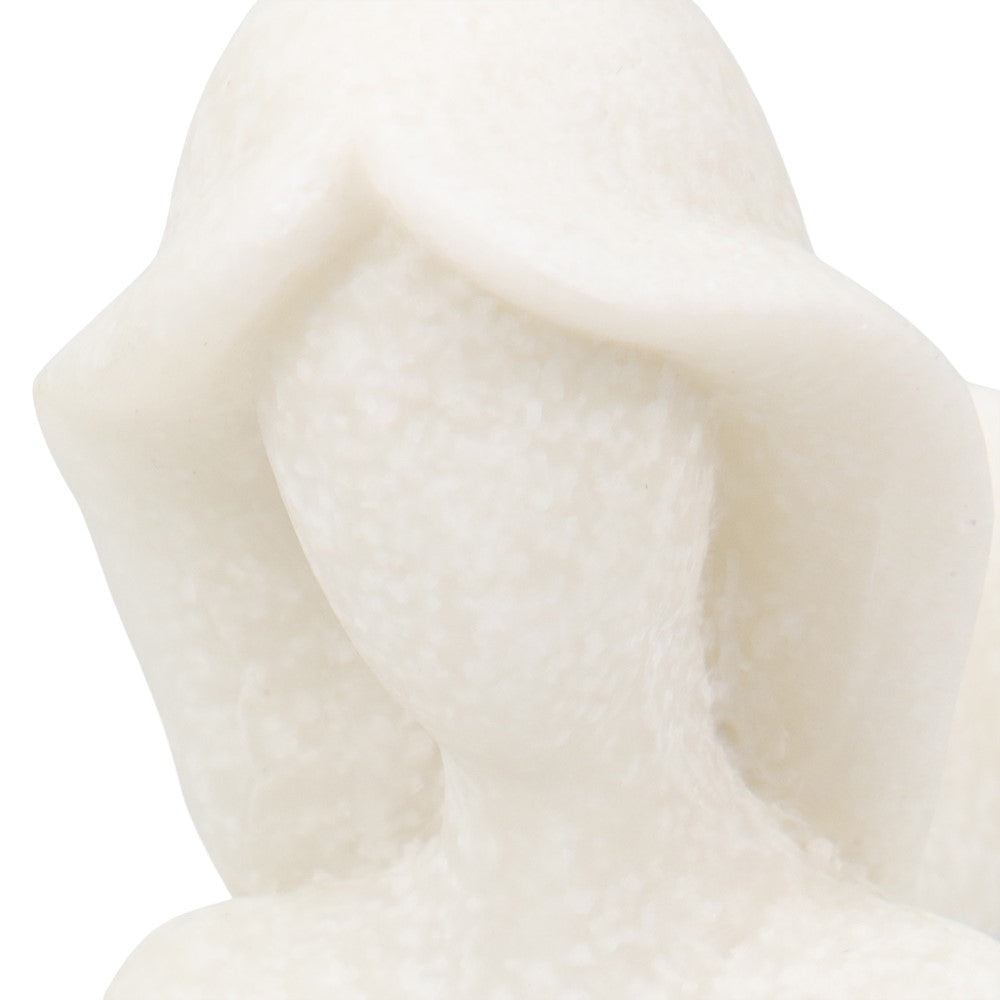 Abstract white sculpture of a hooded figure.