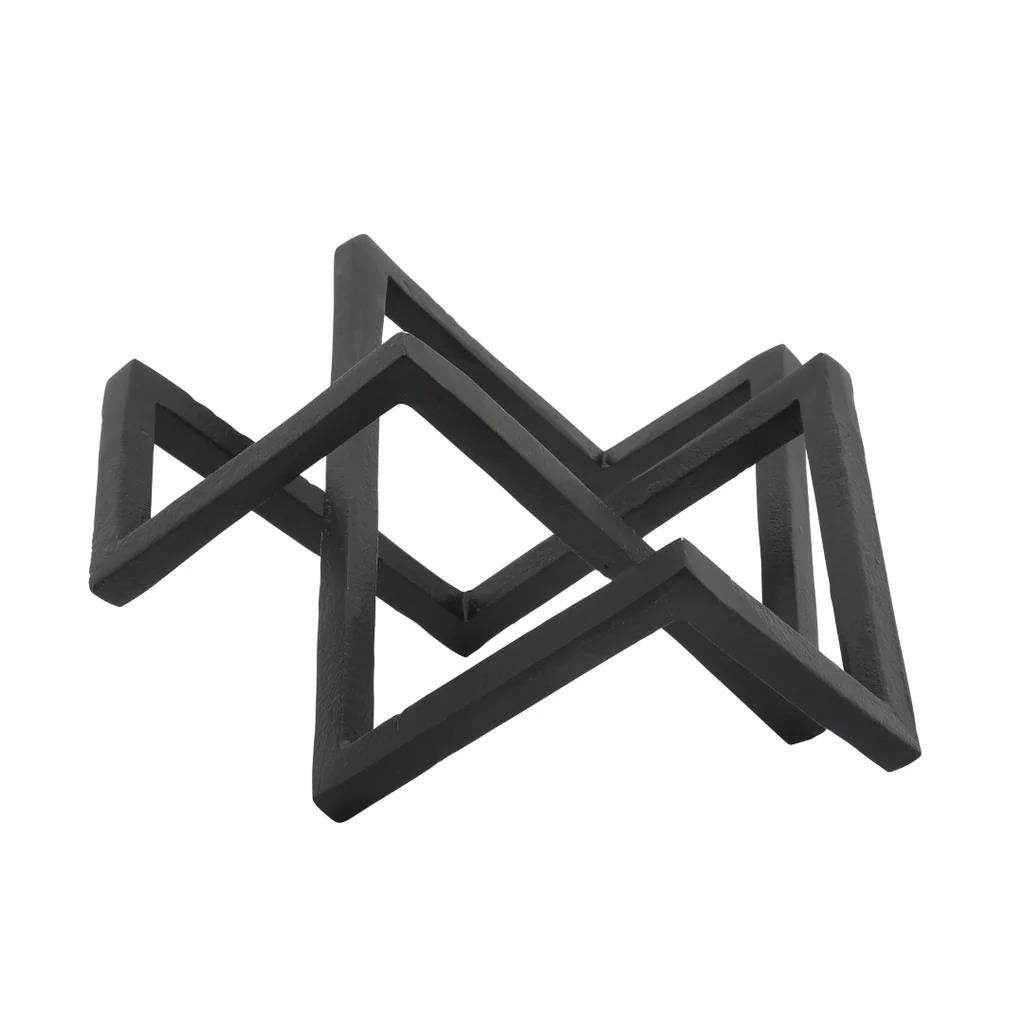 Black geometric sculpture with intersecting triangular shapes.